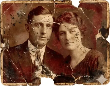 Severely damaged vintage couple portrait with tears and stains before professional restoration